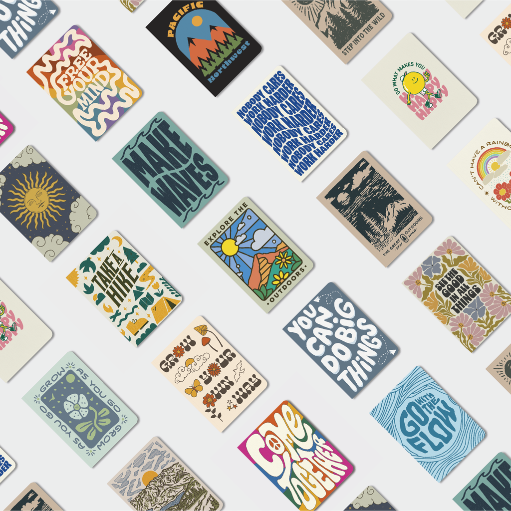 PNW notebook set with assorted illustrated covers on tabletop