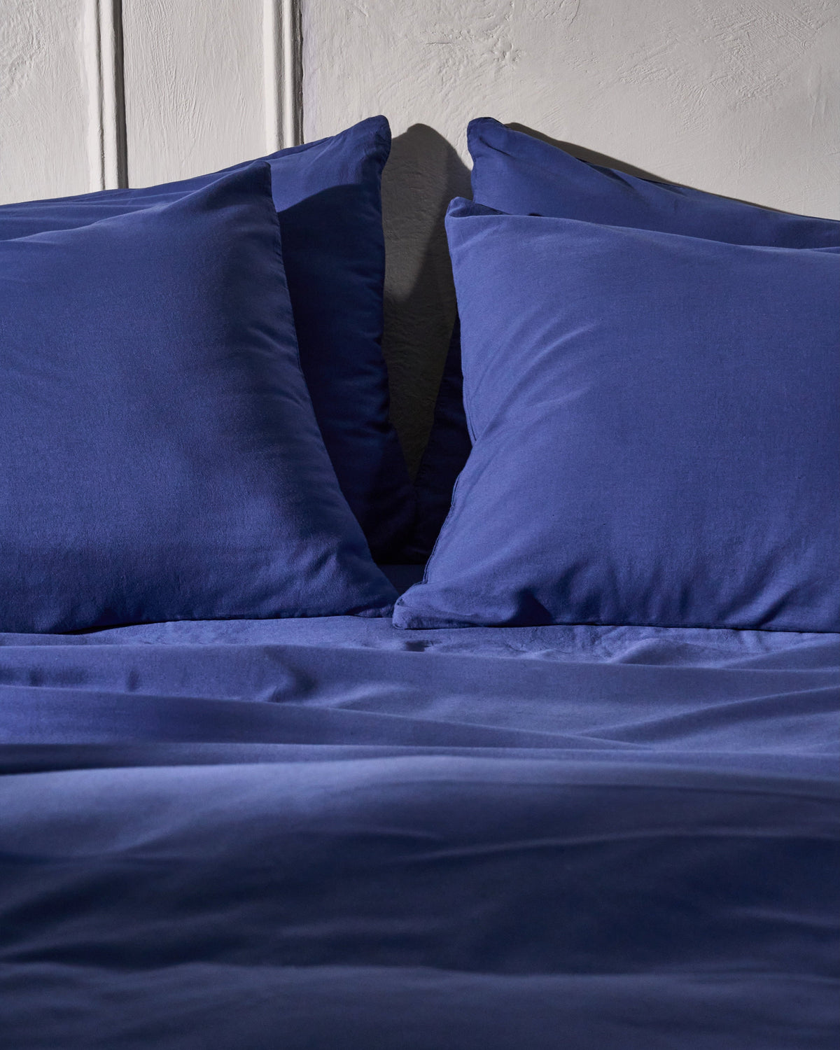 Blue duvet cover with two pillowcases shown close-up