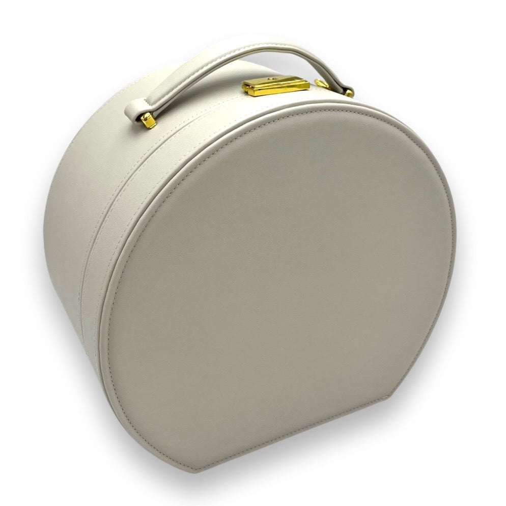 Gray round keepsake box with top handle and gold-tone latch on front