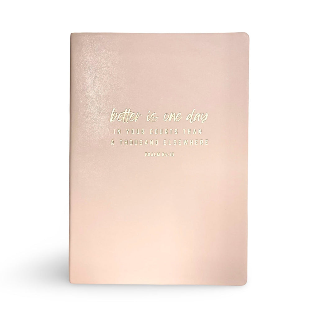 Blush pink soft leather journal with centered inspirational quote on front cover