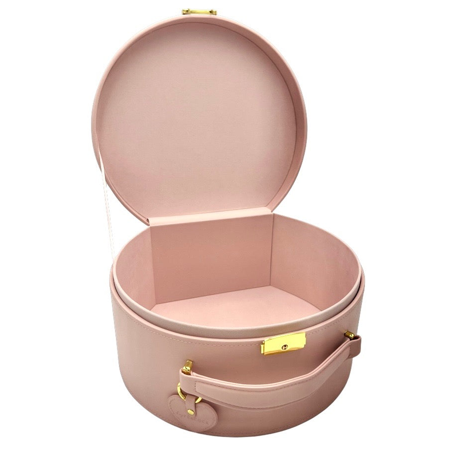 Blush pink round keepsake box open, showing empty fabric-lined interior