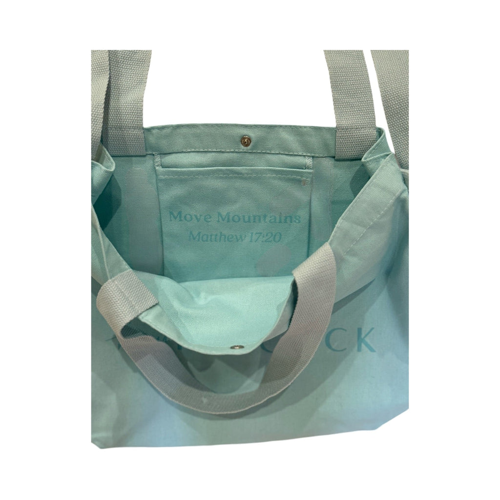 Aqua canvas tote bag open top with interior pocket and logo print