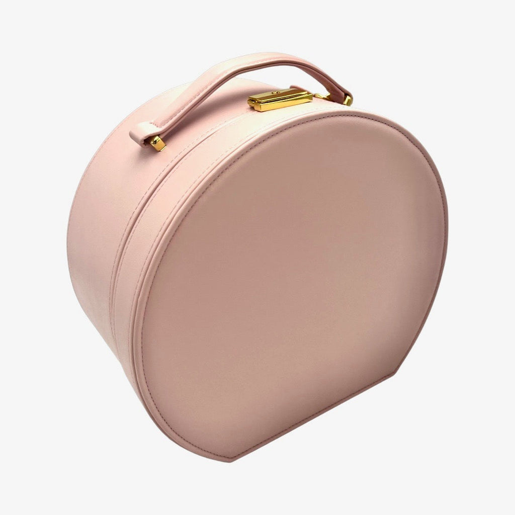 Blush pink keepsake box with curved handle and gold clasp hardware