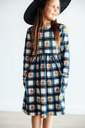 Girls long-sleeve plaid twirl dress with pumpkin print and front pocket, blue black white