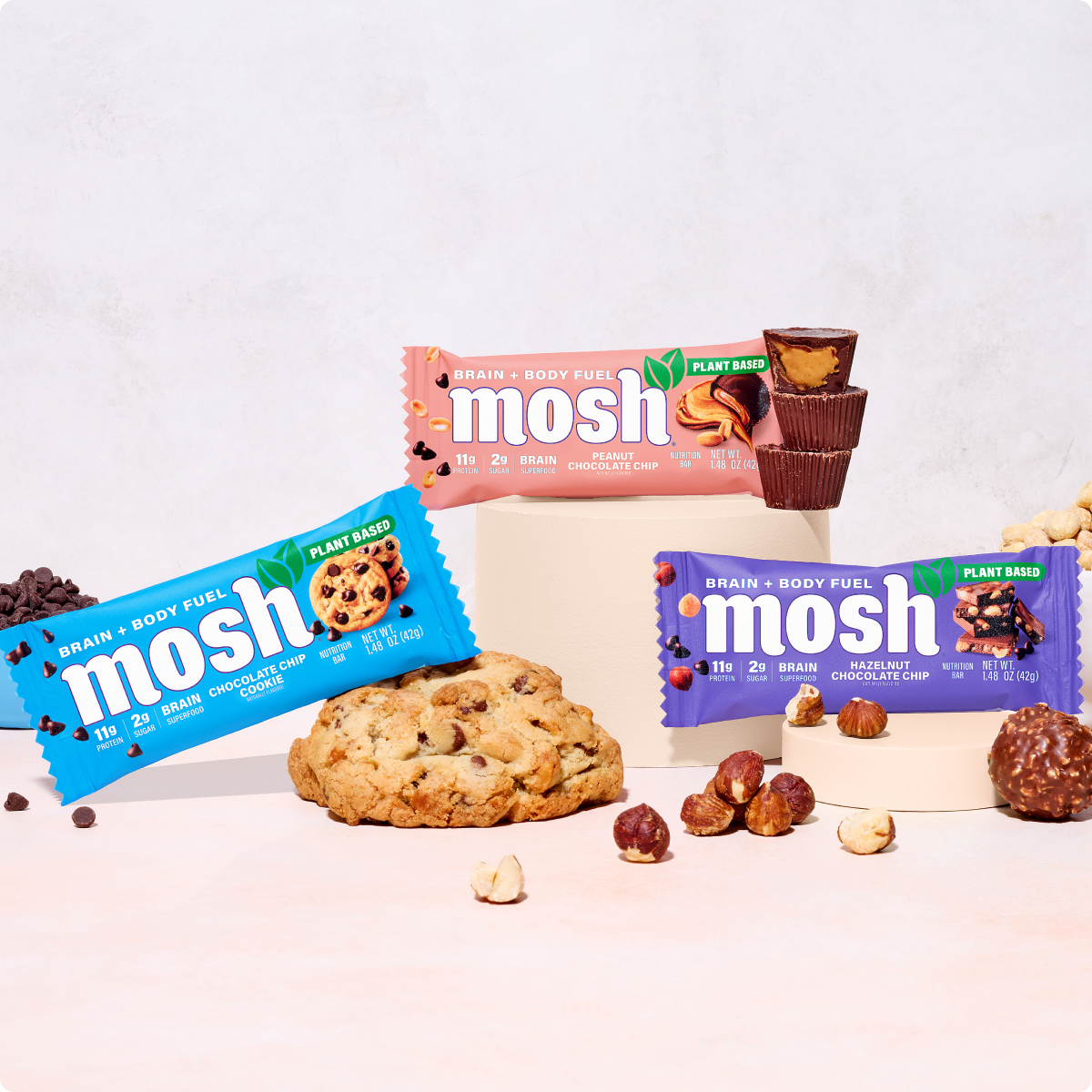 Assorted plant-based snack bars with cookie pieces and nuts on a tabletop