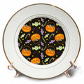 Porcelain Halloween plate with dark pattern of jack-o'-lanterns, stars, and candy canes