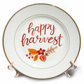 White porcelain decorative plate with brown rim, “happy harvest” text and autumn leaves