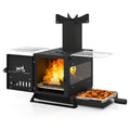 Black compact wood burning stove with pot rack, open oven firebox with visible flames