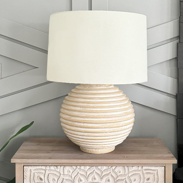 Weathered cream ribbed ceramic table lamp with off-white fabric drum shade