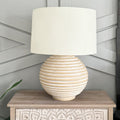 Weathered cream ribbed ceramic table lamp with off-white fabric drum shade