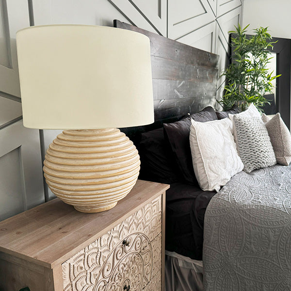 Weathered cream ribbed ceramic table lamp with off-white fabric drum shade