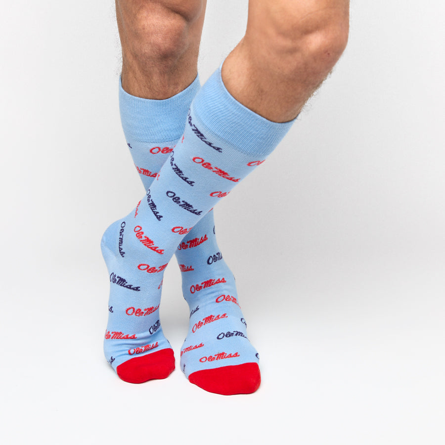 Light blue crew socks with red script print and red heel and toe
