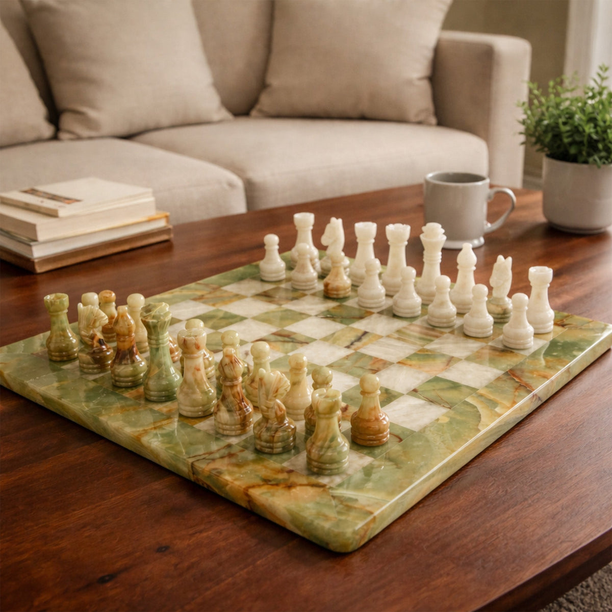 Green and white marble chess board with gold and white chess pieces, set up on grid