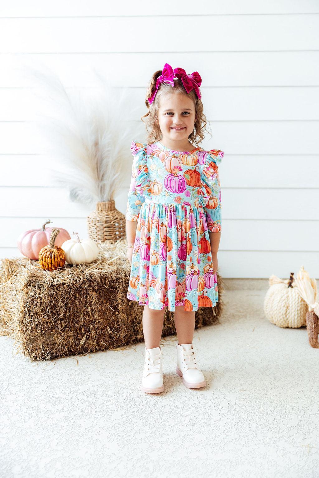 Girls pumpkin print ruffle sleeve twirl dress with a tiered skirt