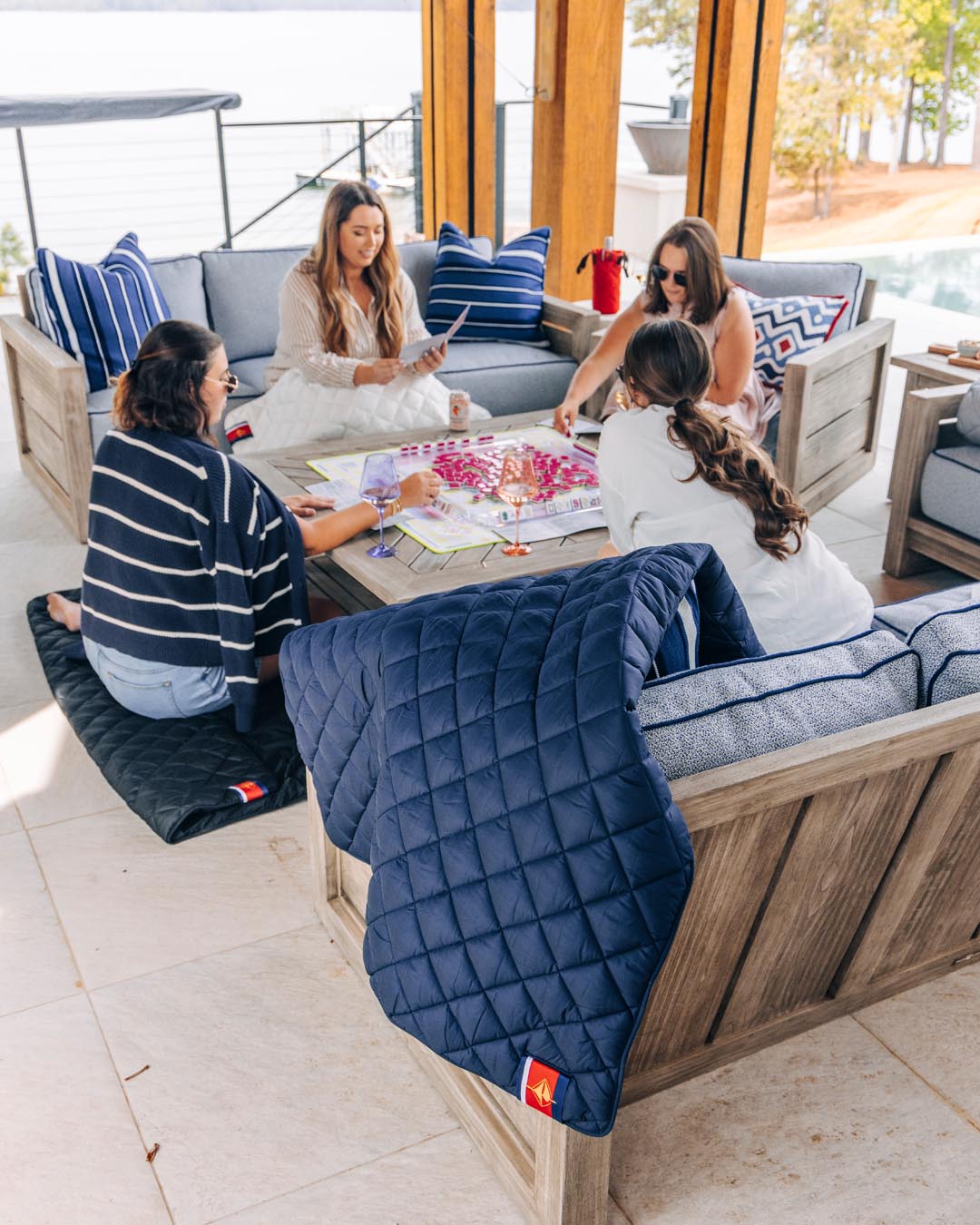 Waterproof puffer blanket with pockets, navy quilted design