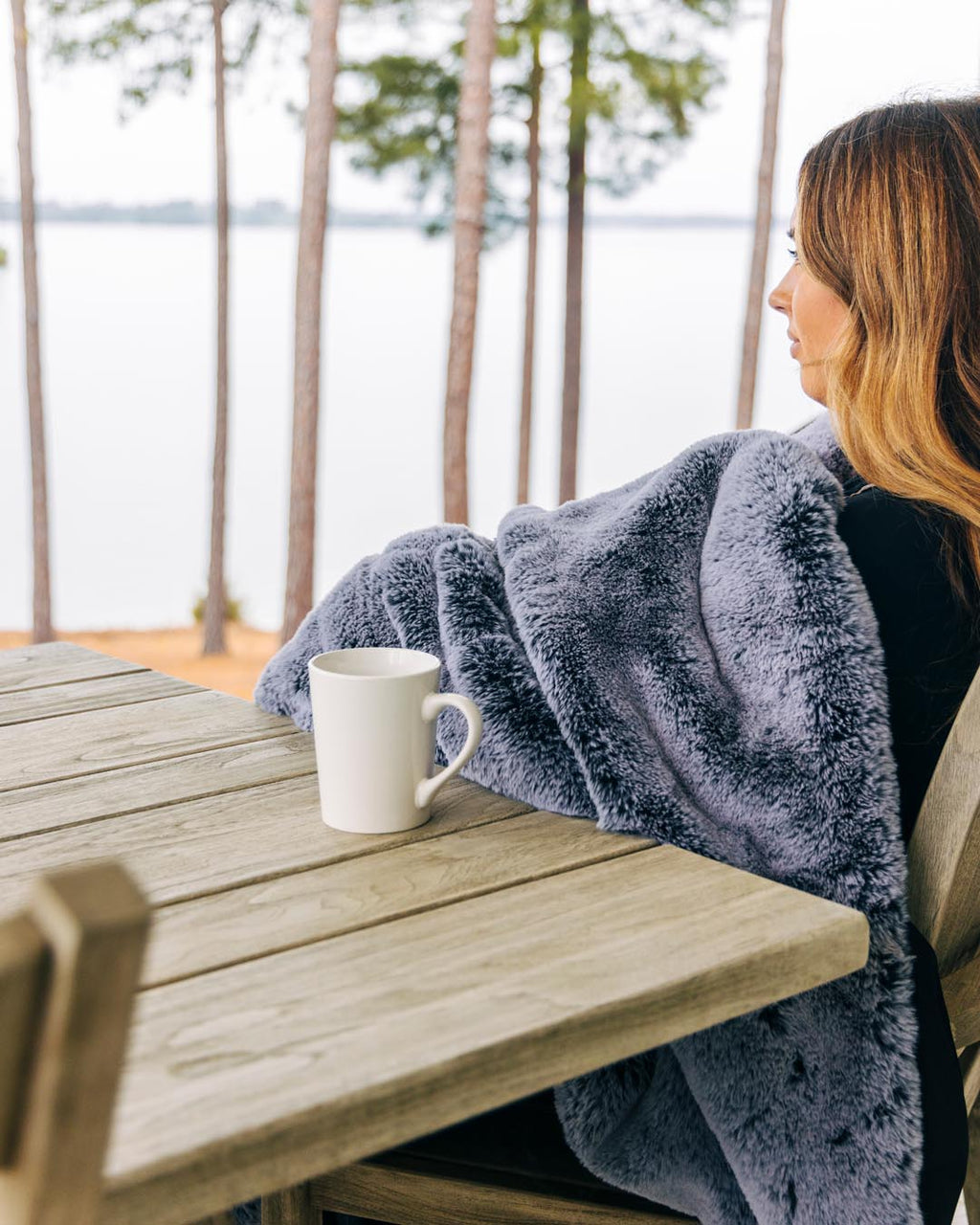 Outdoor blanket throw, dark grey plush fabric with cozy pile