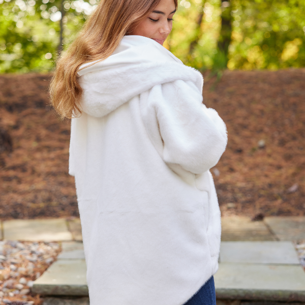 White waterproof cardigan with oversized hood and full back coverage