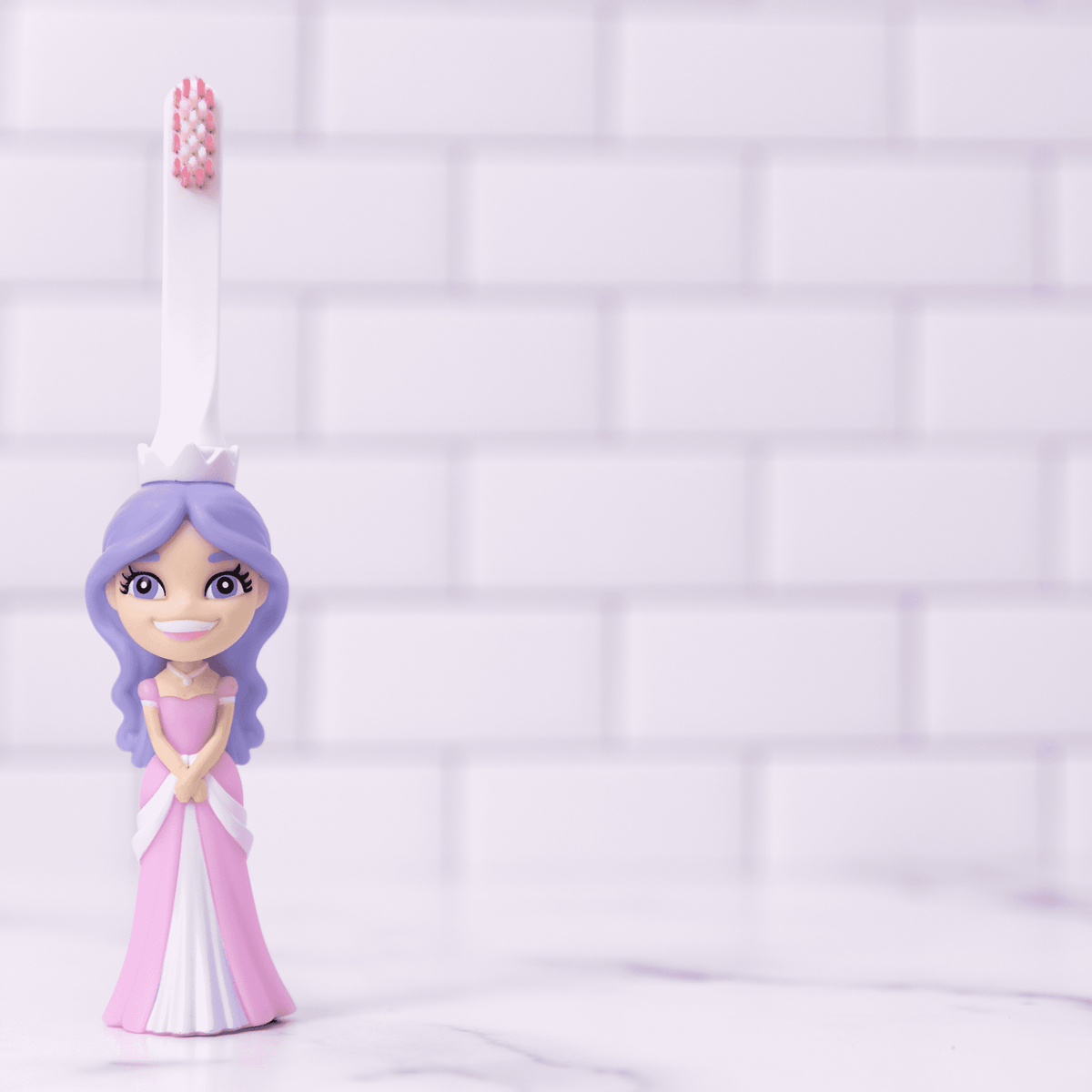 Princess-themed kids toothbrush with white handle and pink bristles