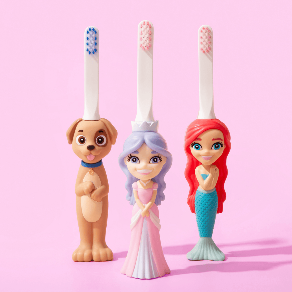 Set of three kids character toothbrushes: dog, princess, and mermaid designs