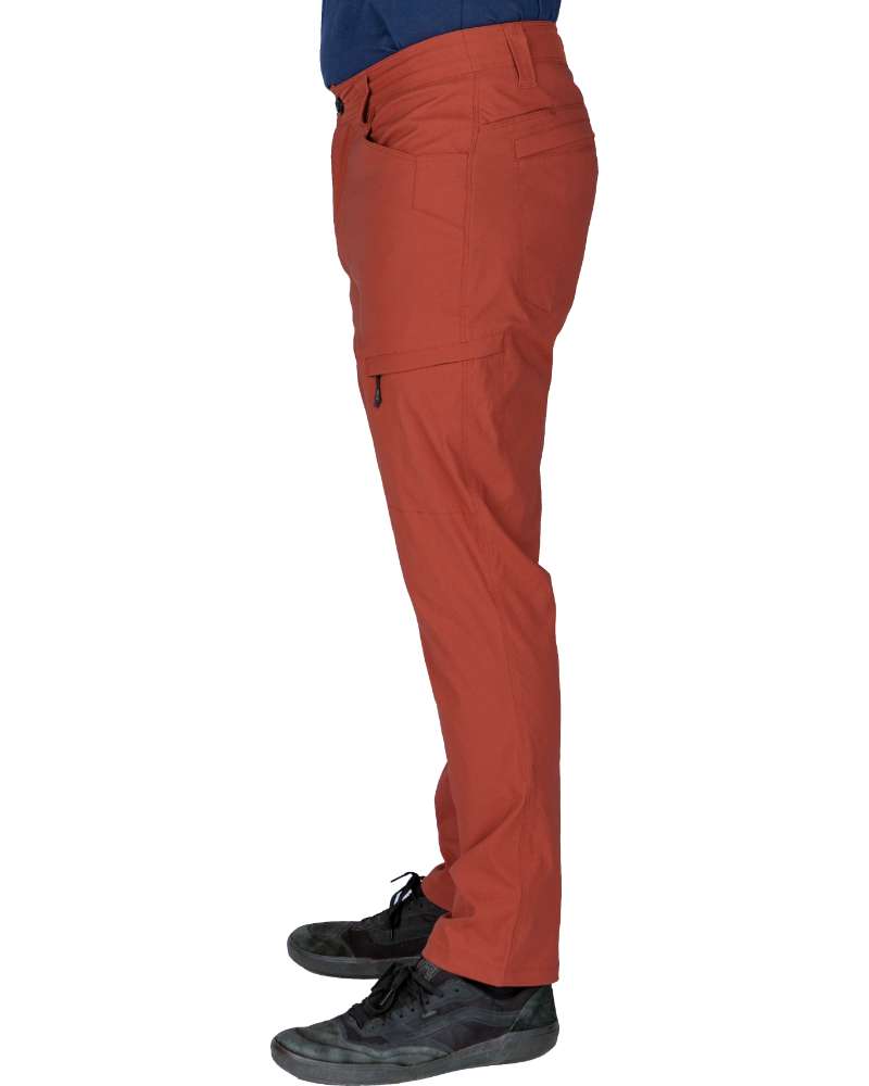 Rust red tapered pants shown from side with cargo pocket seam and belt loops