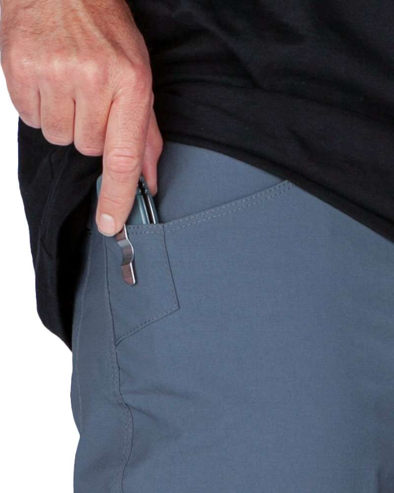 Gray-blue pant side pocket with zipper pull and attached key clip