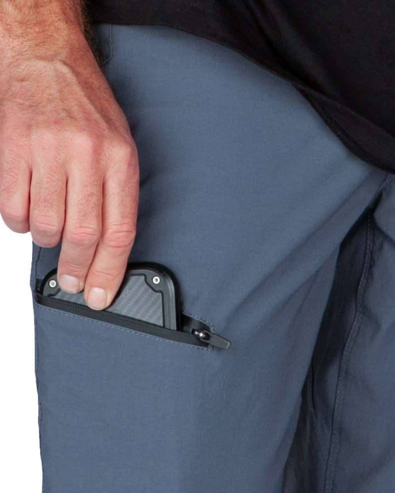 Gray-blue pant pocket with zipper pull and black metal clip