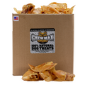 Pig ear dog treats in an open cardboard box, curled golden-brown pieces