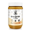 Pumpkin peanut-butter for dogs in white ribbed jar, amber spread