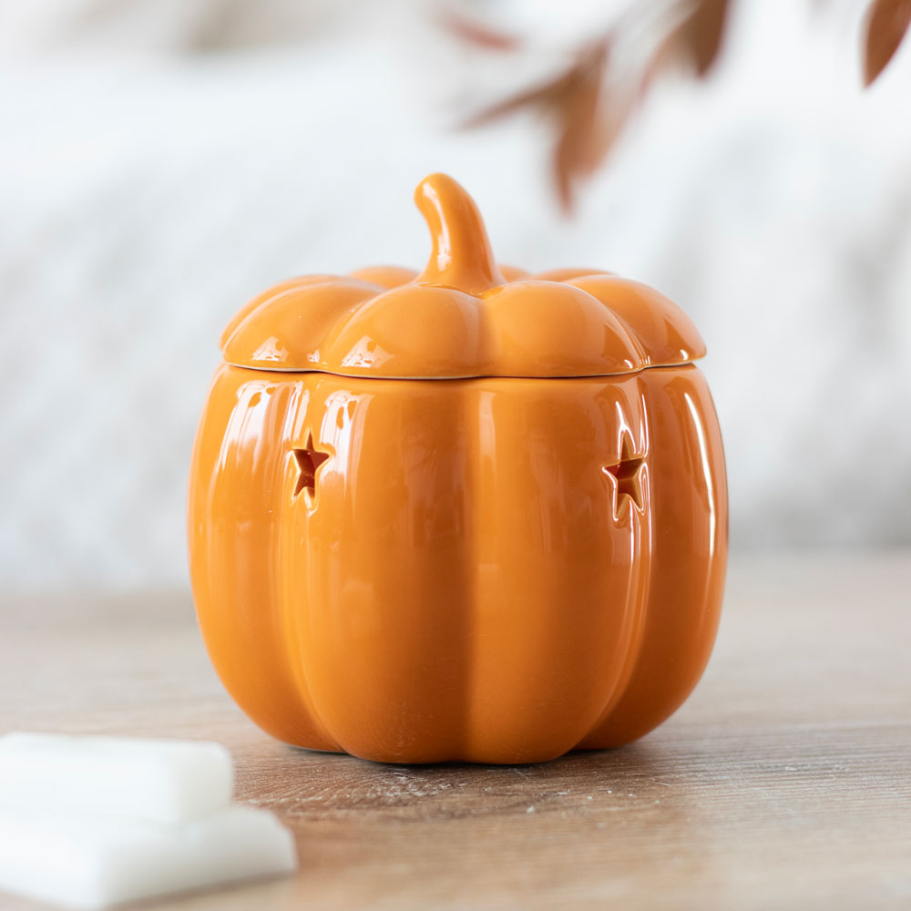 Orange ceramic pumpkin wax melt burner with domed lid and curved spout