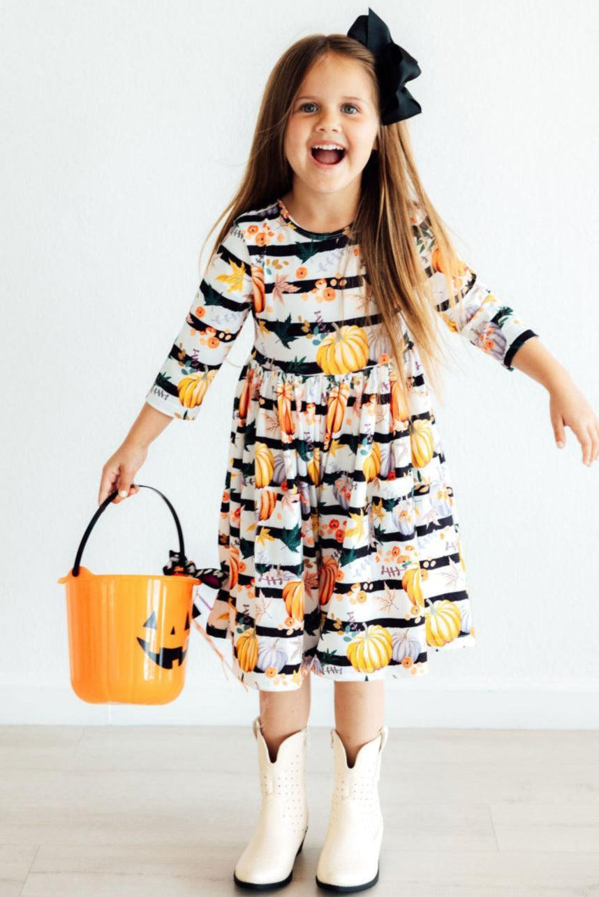 Girls' pumpkin print tiered twirl dress with 3/4 sleeves and ruffled layers
