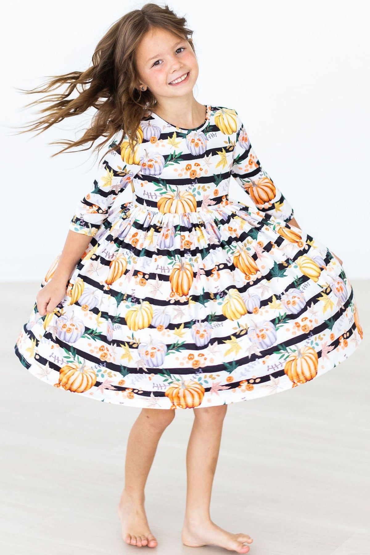 Girls' pumpkin print twirl dress, flared tiered skirt in black-and-white stripes