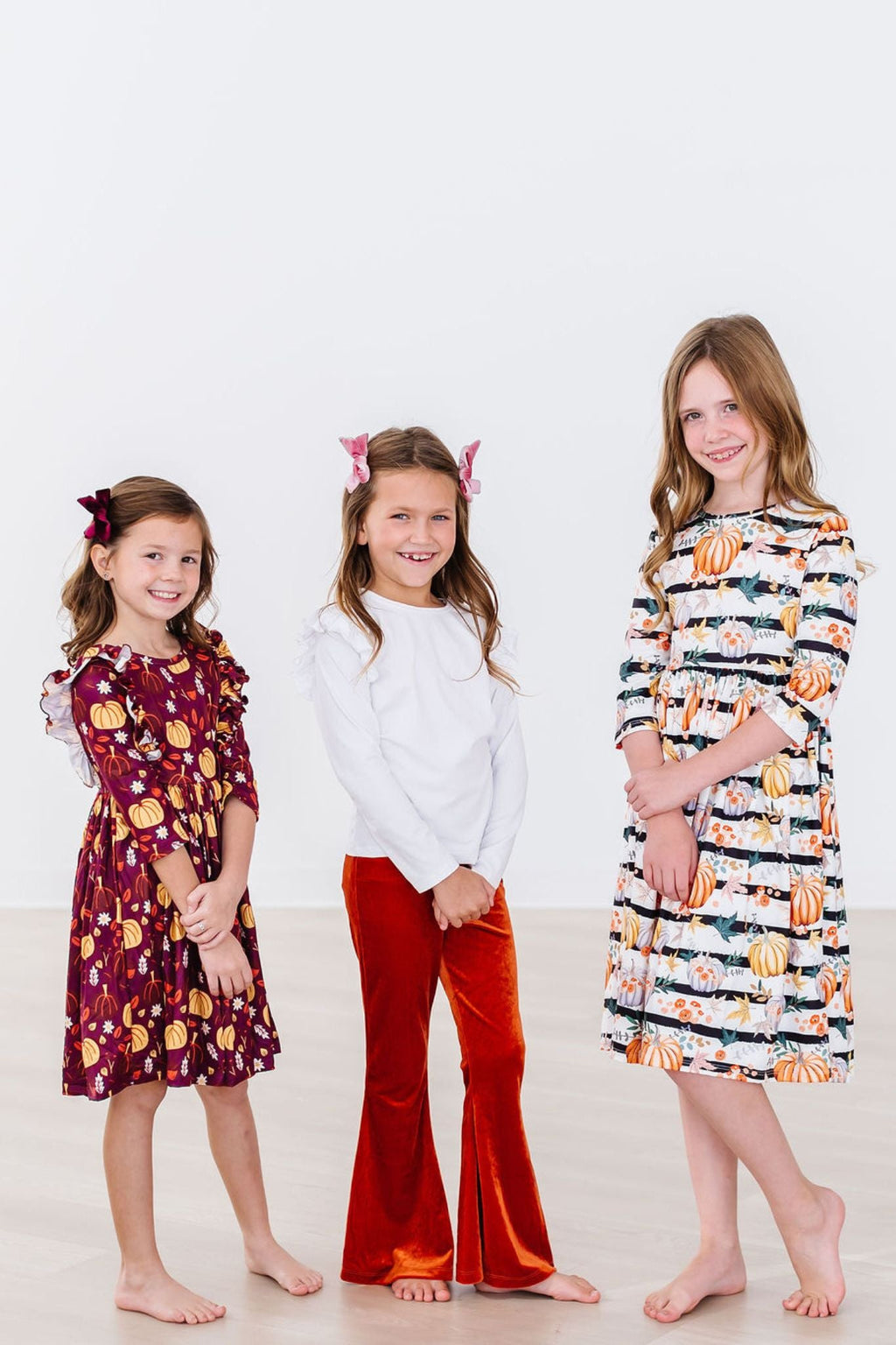 Girls' pumpkin print 3/4 sleeve twirl dress with black stripe and orange pumpkins