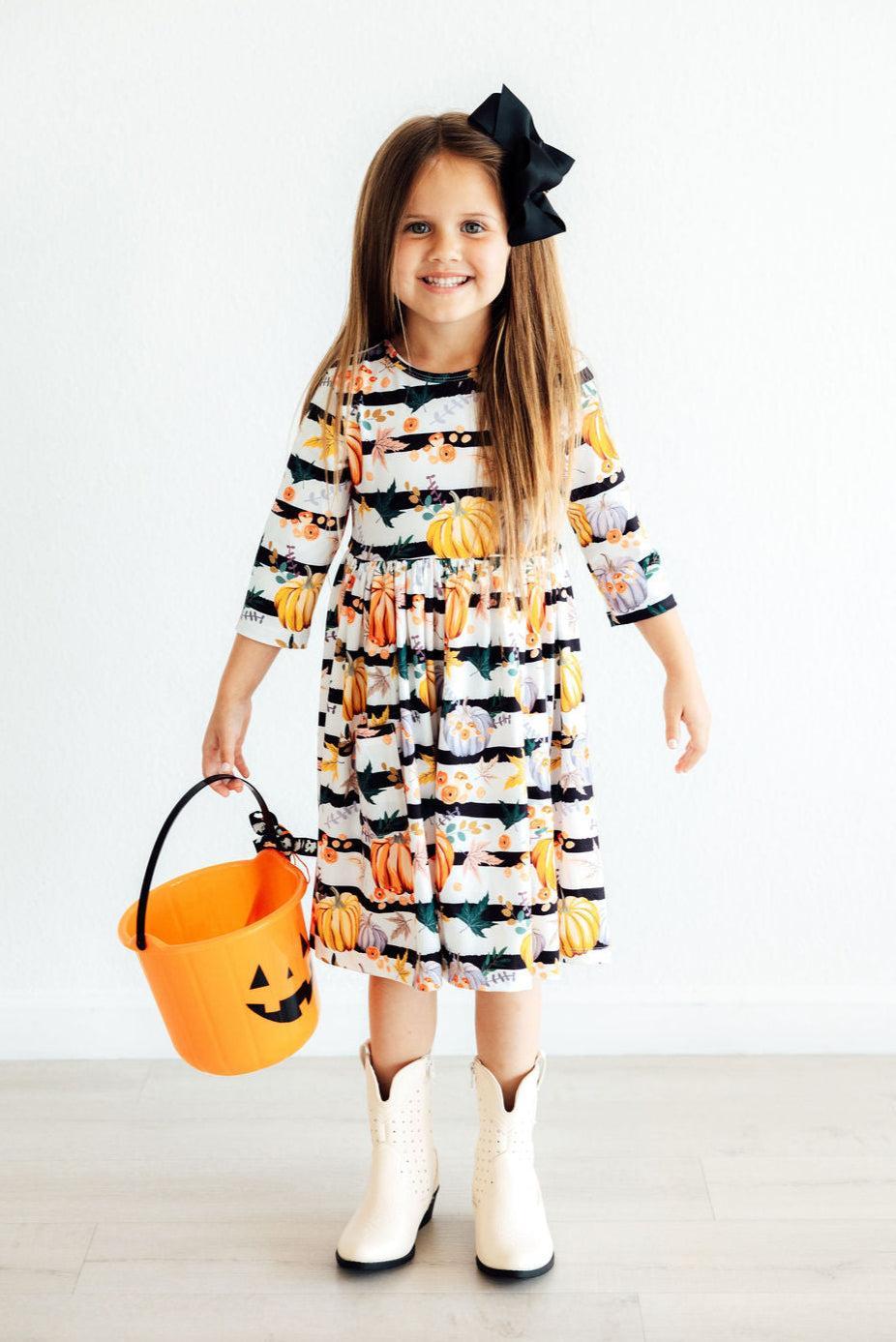 Girls' pumpkin print tiered twirl dress with 3/4 sleeves, gathered ruffle bands