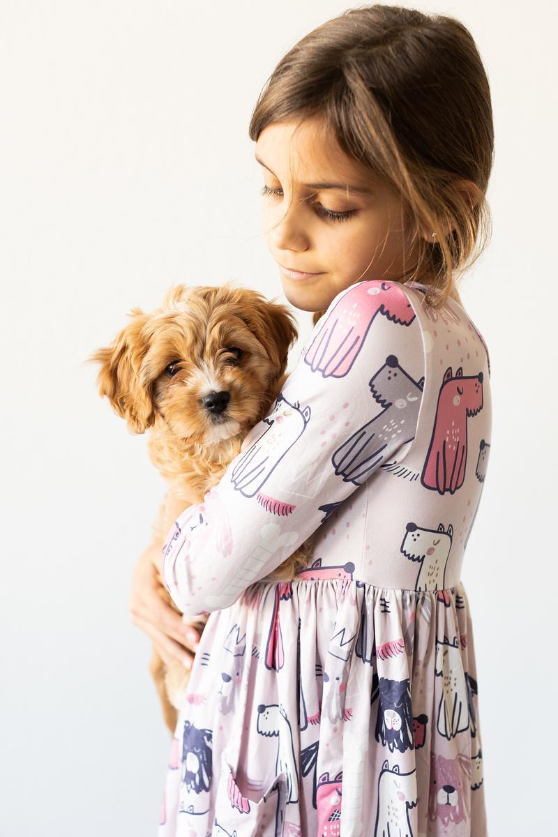 Girls' light pink dog-print 3/4-sleeve twirl dress, back view with tiered skirt