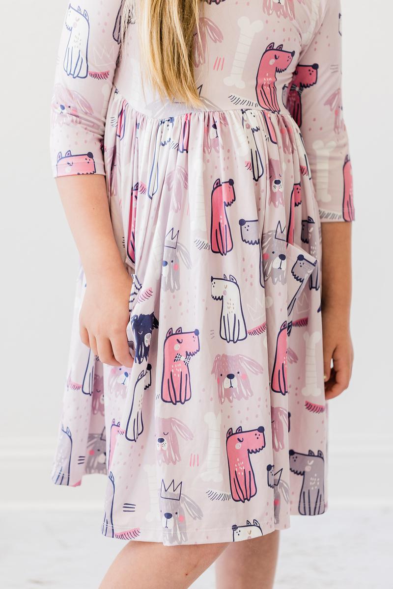 Girls' light pink 3/4-sleeve dog-print twirl dress, back view with gathered waist