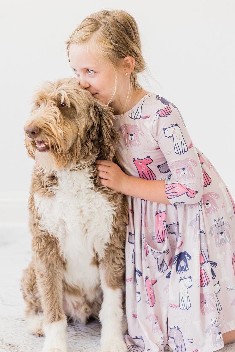 Girls' light pink dog-print twirl dress with gathered waist and flowing hem