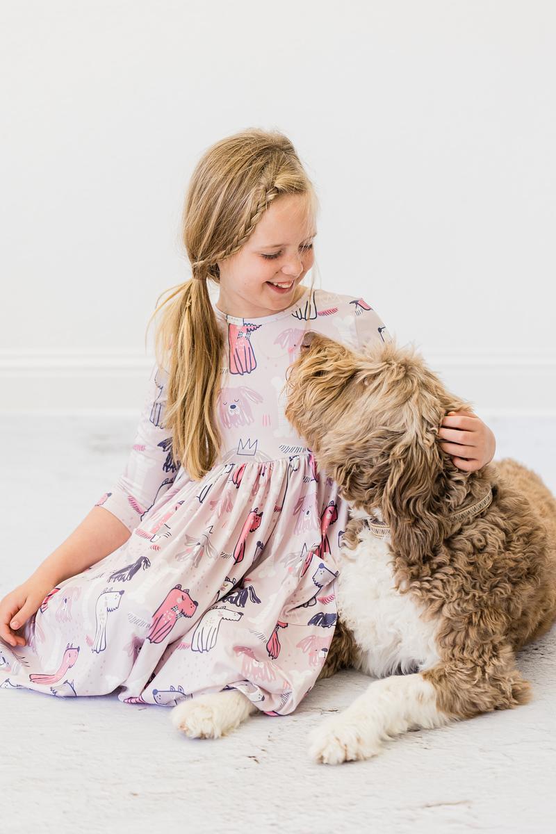 Girls' light pink dog-print twirl dress with gathered skirt, front view