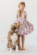 Girls' light pink dog-print twirl dress with gathered waist and fluttery skirt hem