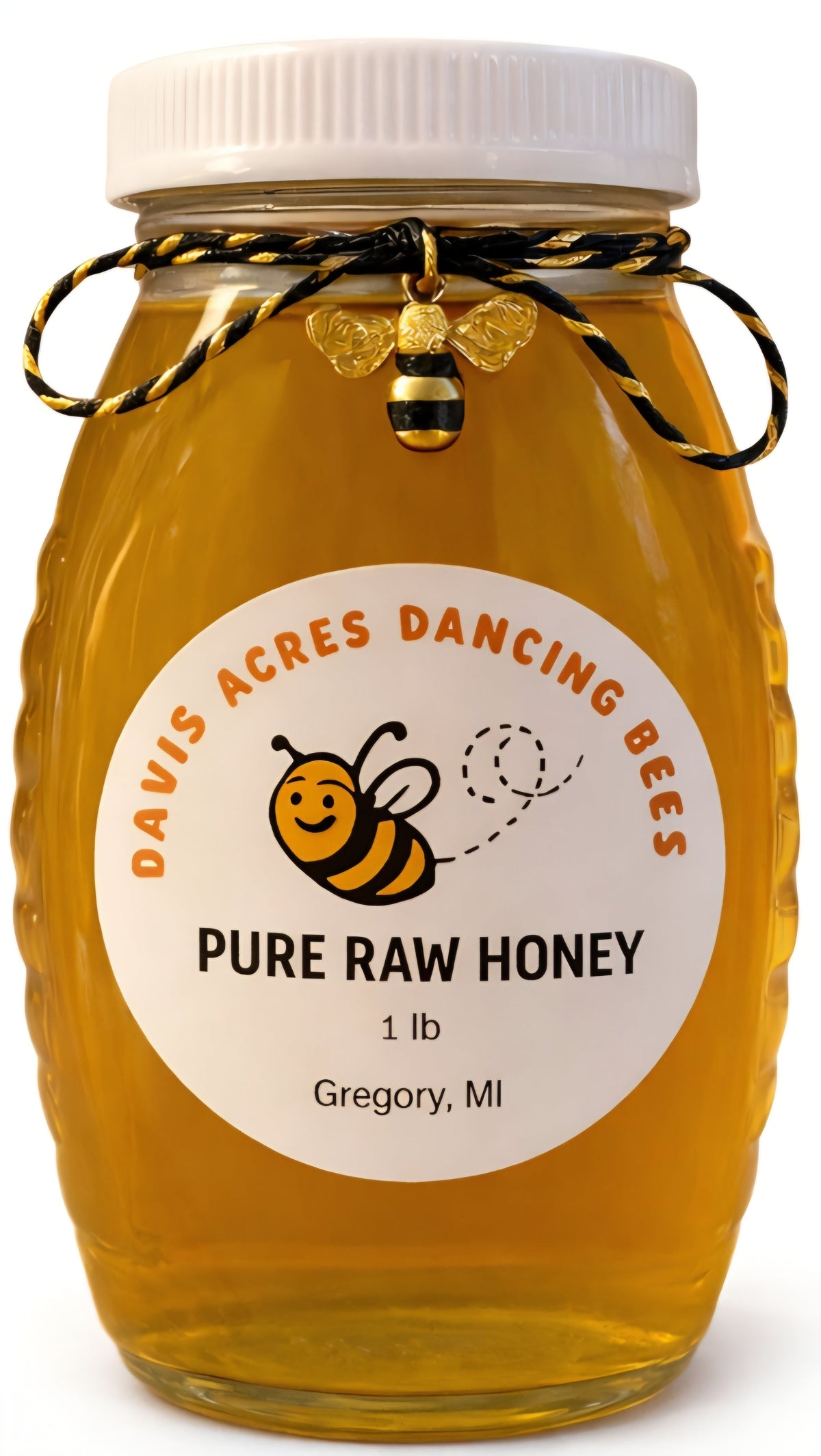 Amber glass honey jar with white lid and ribbon tie, labeled pure raw honey 1 lb