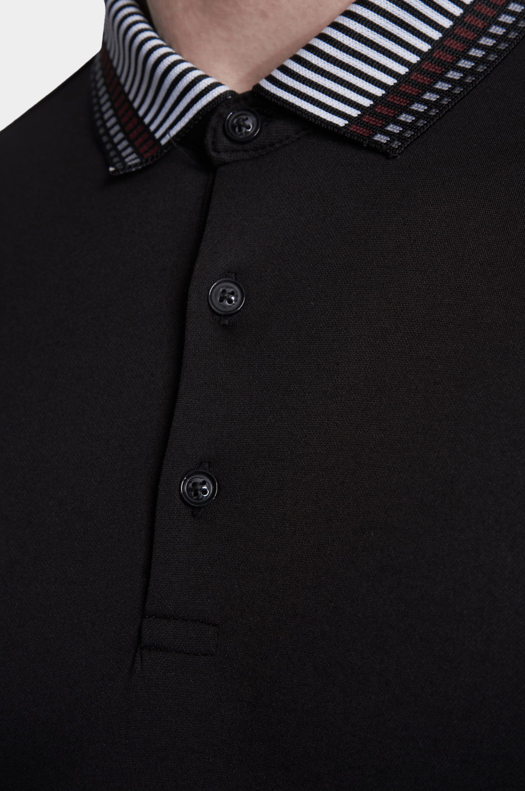 Black cotton polo placket with three buttons and striped collar trim