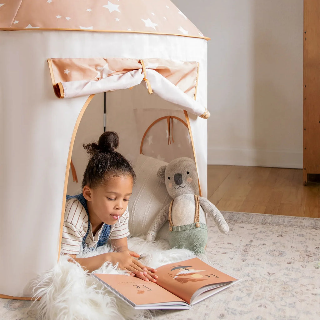 Light tan play tent and tunnel with star roof, side opening, and hanging strap