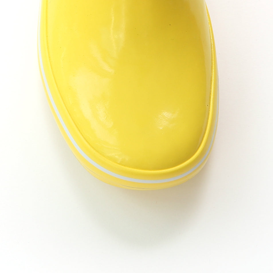 Yellow rain boot front with smooth glossy finish and white striped sole