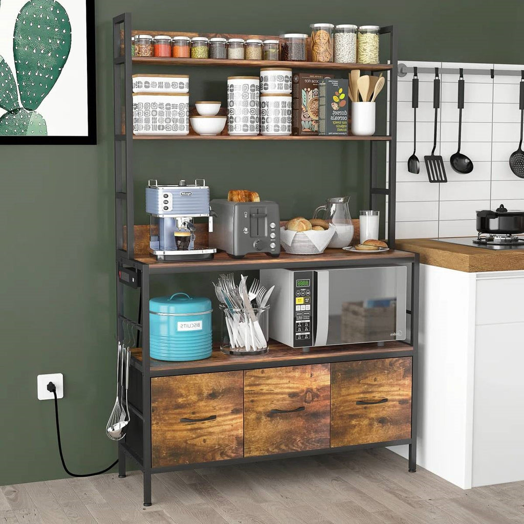 Black kitchen baker's rack with brown wood drawer fronts and open storage shelves