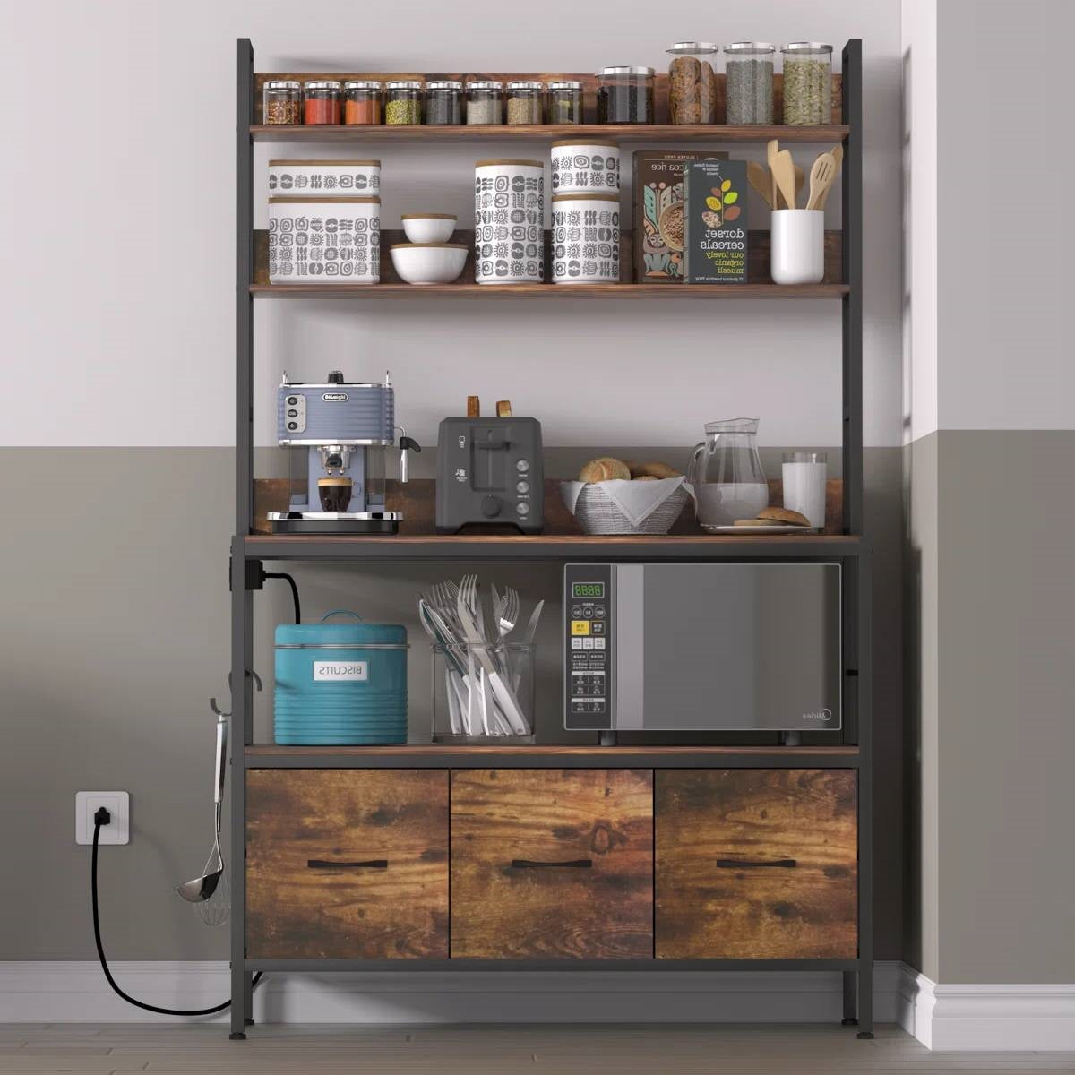 Black metal baker's rack with brown wood drawer cabinets and open upper shelves