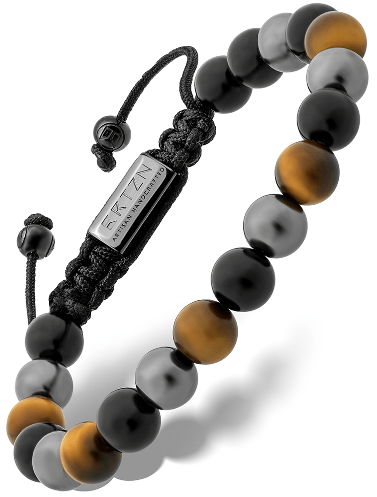 Triple bead bracelet with black and gold-toned round beads and adjustable cord tie