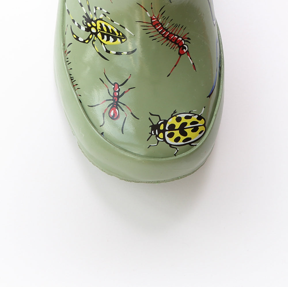 Green rain boot toe with colorful beetle and bug graphic