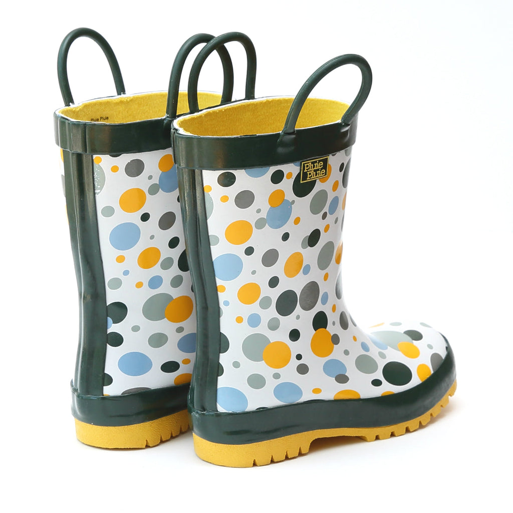 Pair of white rain boots with multicolor dots, dark green upper and treaded outsole