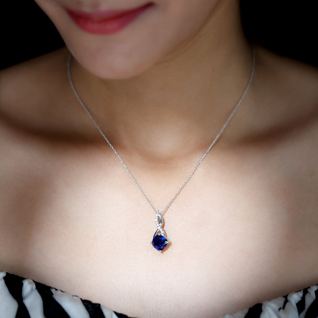 Cushion-cut blue sapphire infinity pendant necklace with silver-tone chain