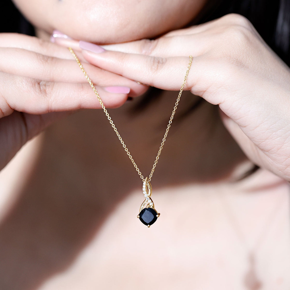 Gold infinity necklace with cushion black diamond pendant