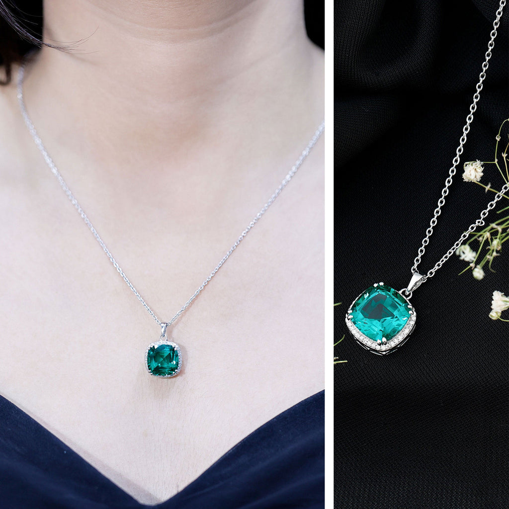 Silver-tone necklace with small cushion emerald pendant on a delicate chain